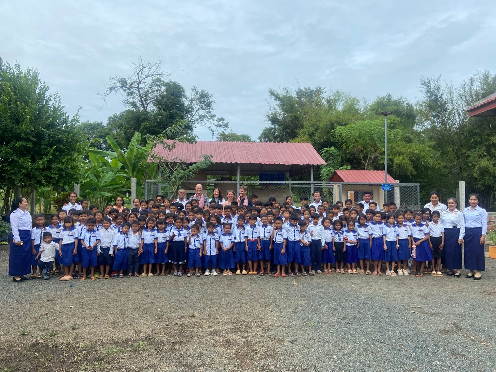 The whole student body of one of the project schools gathered in front of the new BioSand filter station