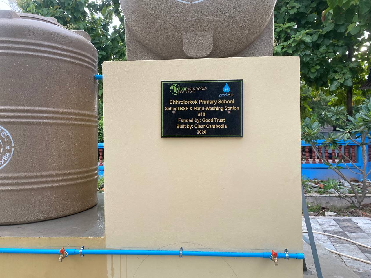 Completed water station and plaque at Chhrolorkok Primary School, funded by Good Trust, 2026