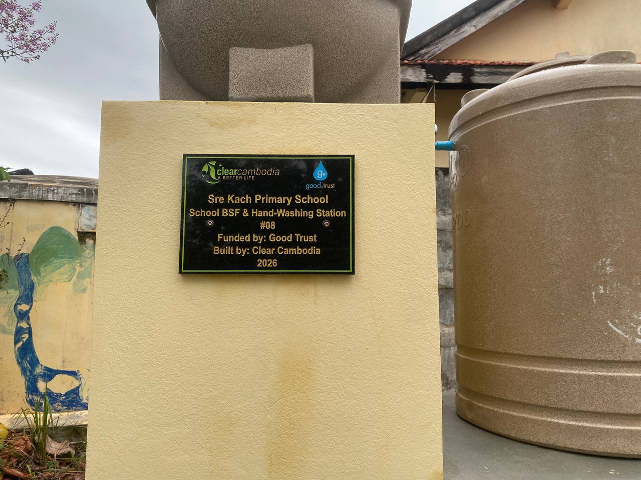 Completed water station and plaque at Sre Kach Primary School, funded by Good Trust, 2026